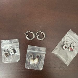 Judith Ripka sterling silver hoop earrings with changeable charms.